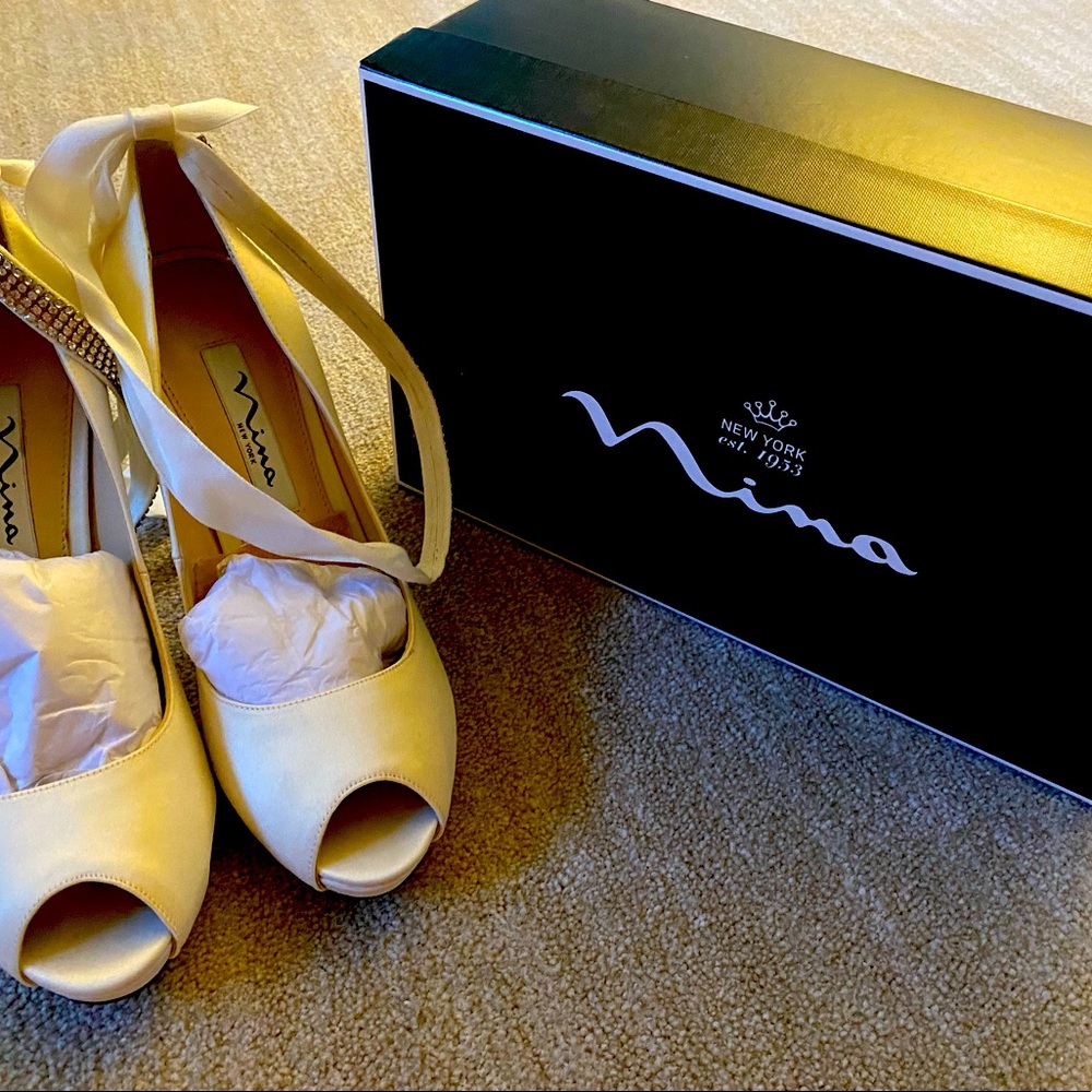 Nina size 7 ivory heels with rhinestone and satin. Worn once at my wedding.